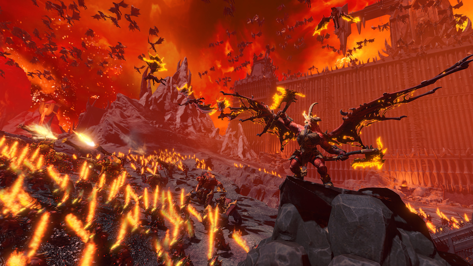 An army of demons fighting on a fiery battlefield during one of the best Total War games, Total War: Warhammer 3