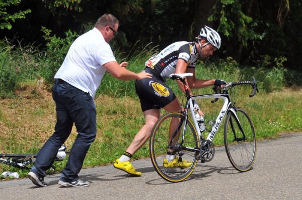 Stijn Neirynck (Topsport Vlaanderen - Mercator) gets a push after a mechanical.