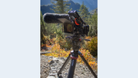 Sachtler tripod being used on a trail on a mountain