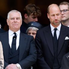 Prince Andrew and Prince William both wear black suits to attend a funeral