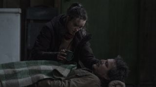 Ellie giving Joel water in HBO's The Last of Us
