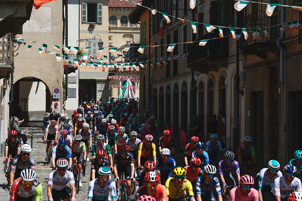 The pack rides after the start during the 19th stage of the 108th Giro d'Italia cycling race of 166kms from Biella to Champoluc on May 30, 2025. (Photo by Luca Bettini / AFP)