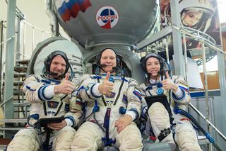 Director Alexey Dudin (left), cosmonaut Oleg Artemyev (center) and actor Alena Mordovina (right) are the backup crew for a scheduled Oct. 5, 2021, launch toward the International Space Station.