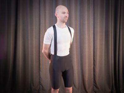 Tester stands in Endura Pro SL EGM bib shorts in black, wearing a white t shirt