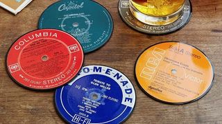 upcycled record coasters on table with drink