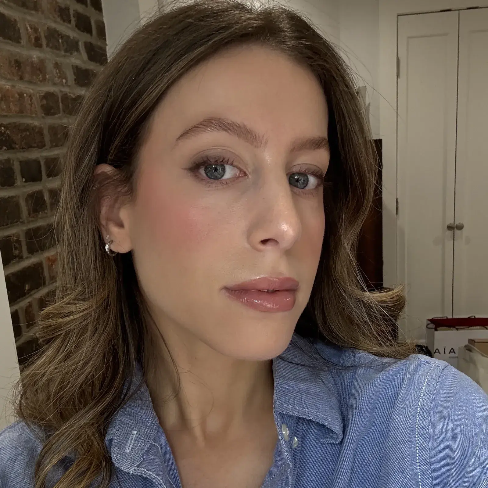 WWW senior beauty editor Jamie Schneider wearing the Tower 28 OneLiner Lip Liner in Work of Art