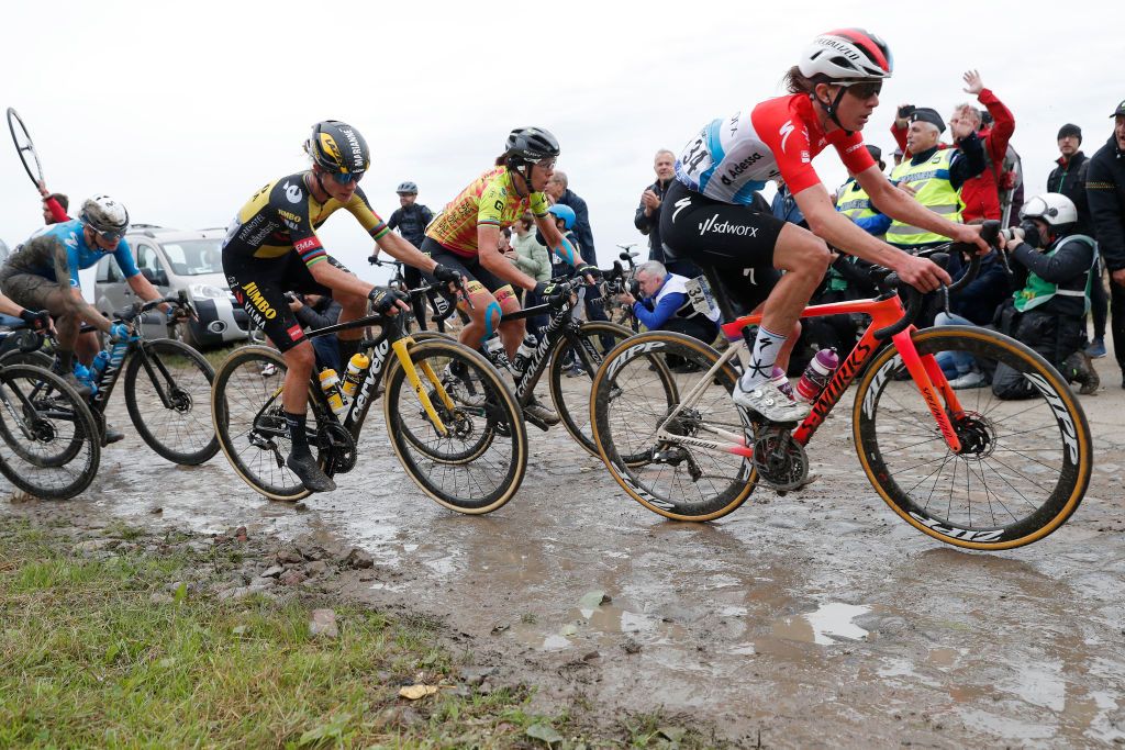 ROUBAIX FRANCE OCTOBER 02 LR Marianne Vos of Netherlands and Jumbo Visma Team Marta Bastianelli of Italy and Team Ale Btc Ljubljana and Christine Majerus of Luxembourg and Team SD Worx compete through cobblestones sector during the 1st ParisRoubaix 2021 Womens Elite a 1164km race from Denain to Roubaix ParisRoubaixFemmes ParisRoubaix on October 02 2021 in Roubaix France Photo by Bas CzerwinskiGetty Images