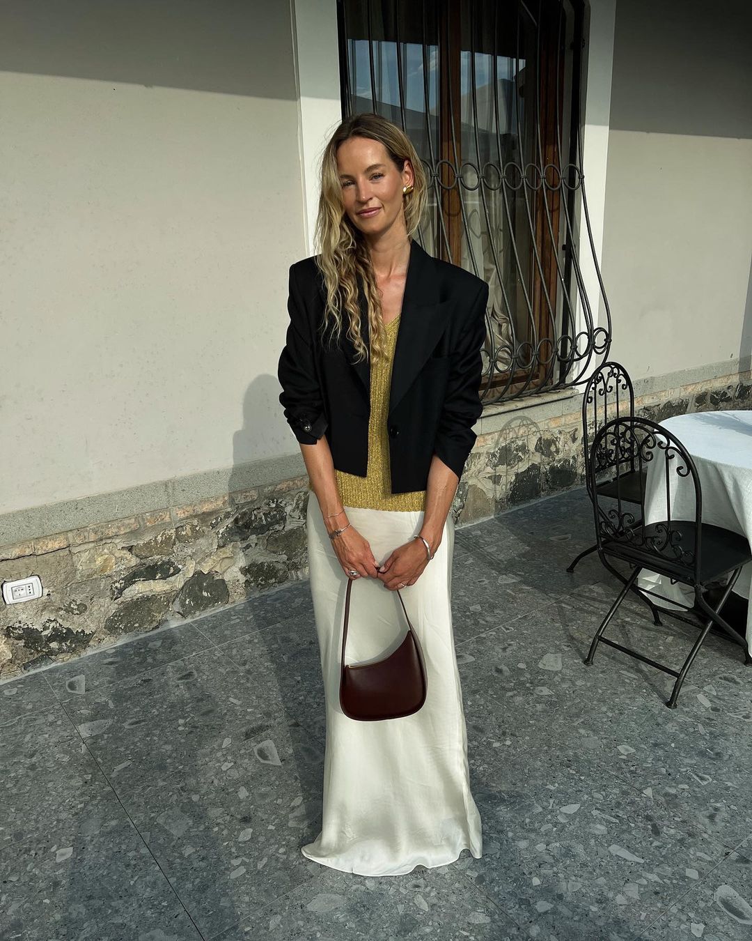 Anouk Yve wearing the Half Moon bag by The Row.