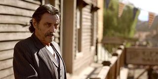 Ian McShane stares down as Al Swearengen in Deadwood: The Movie HBO