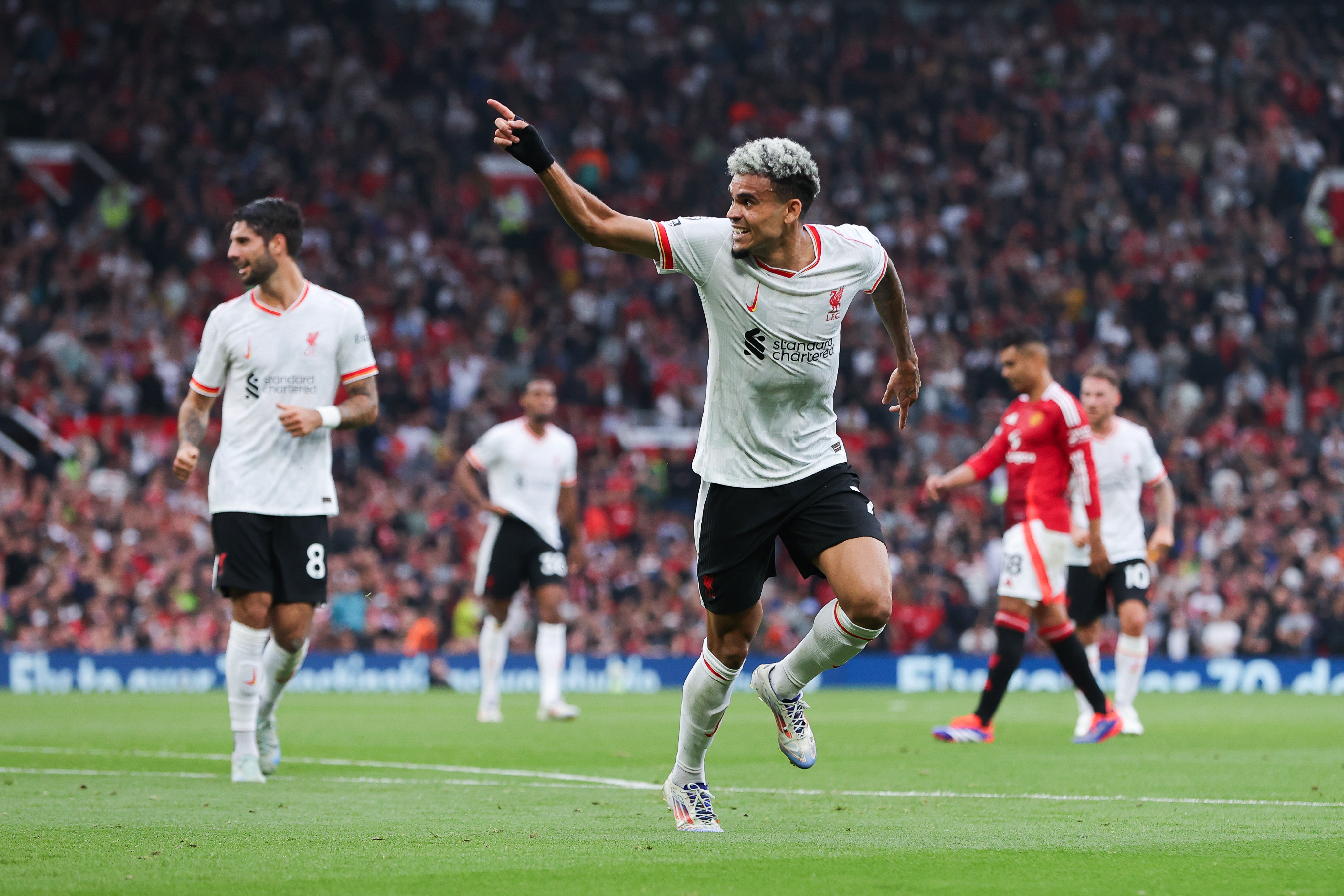 Luis Diaz celebrates after scoring his second goal for Liverpool against Manchester United in the Premier League at Old Trafford in September 2024.