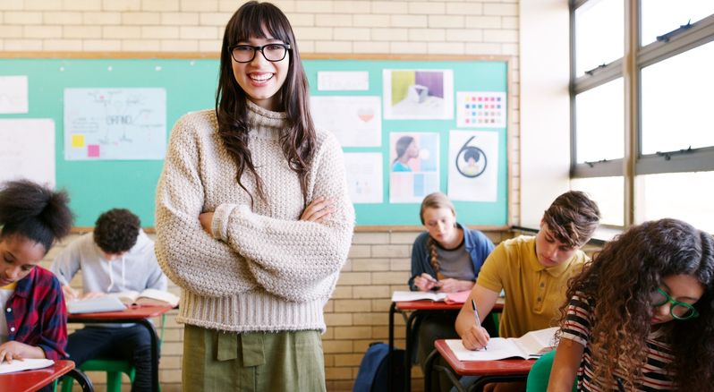 A new teacher standing in front of her class