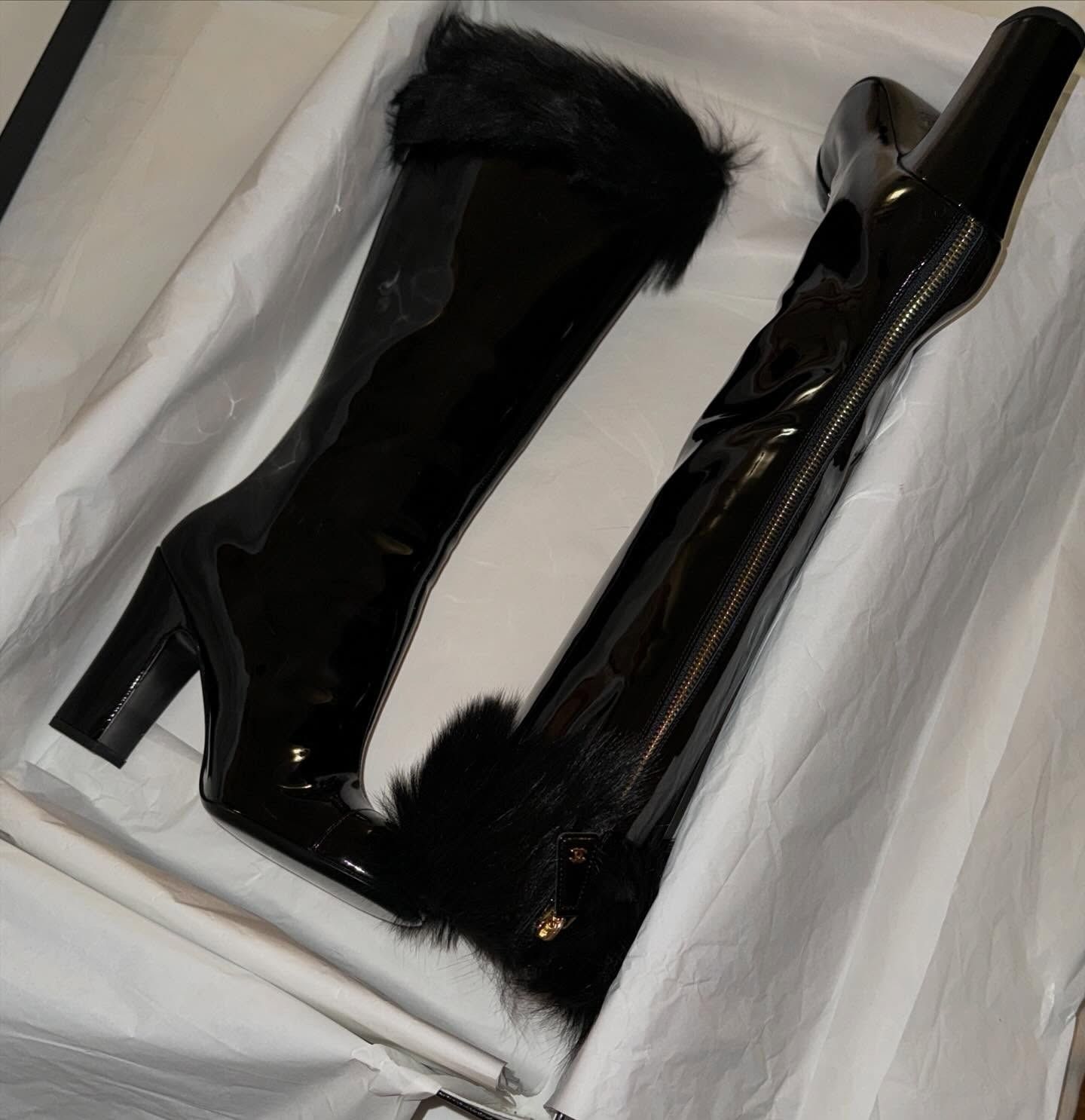 Chanel patent leather knee-high boots.