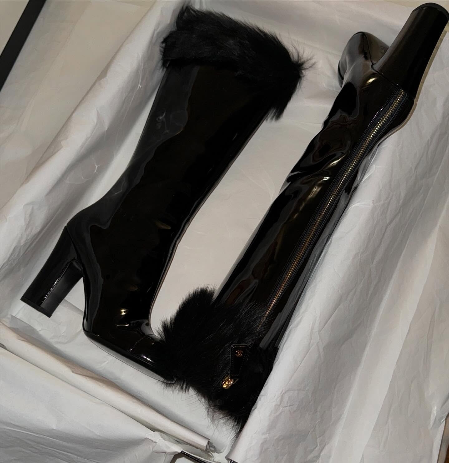 Chanel patent leather knee-high boots.