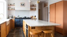 pip rich kitchen with terracotta pantry and granite countertop