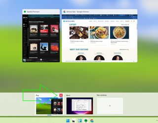 Windows 11 Task View with a green arrow highlighting the close desktop button