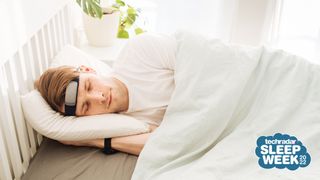 Man sleeping wearing sleep tracking headband