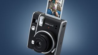 The Fujifilm Instax Mini 40 on a blue background