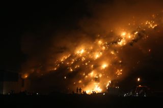 An enormous garbage fire rages in New Delhi on April 26, 2022.