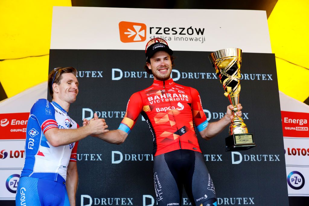 RZESZOW POLAND AUGUST 03 LR Arnaud Demare of France and Team Groupama FDJ on second place stage winner Phil Bauhaus of Germany and Team Bahrain Victorious congratulate on the podium during the podium ceremony after the 79th Tour de Pologne 2022 Stage 5 a 1781km stage from Lancut to Rzeszow TdP22 WorldTour on August 03 2022 in Rzeszow Poland Photo by Bas CzerwinskiGetty Images