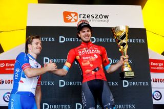 RZESZOW POLAND AUGUST 03 LR Arnaud Demare of France and Team Groupama FDJ on second place stage winner Phil Bauhaus of Germany and Team Bahrain Victorious congratulate on the podium during the podium ceremony after the 79th Tour de Pologne 2022 Stage 5 a 1781km stage from Lancut to Rzeszow TdP22 WorldTour on August 03 2022 in Rzeszow Poland Photo by Bas CzerwinskiGetty Images