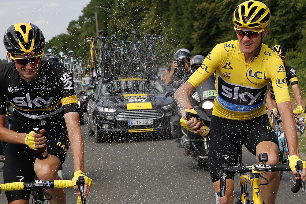Chris Froome celebrates with his Team Sky teammates on the final Tour de France stage
