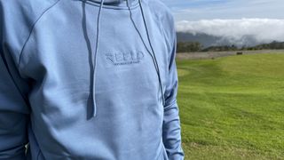 A detailed look at the logo on the Reflo Lapter hoodie