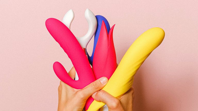 best dildo: hands holding a range of sex toys