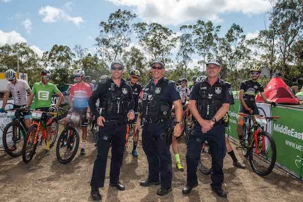 Queensland police lend a helping hand after a 'military ordnance' is found close to the start of Monday's third stage
