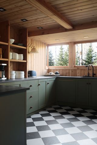 The Minne Stuga dark green Ikea kitchen with checked floor