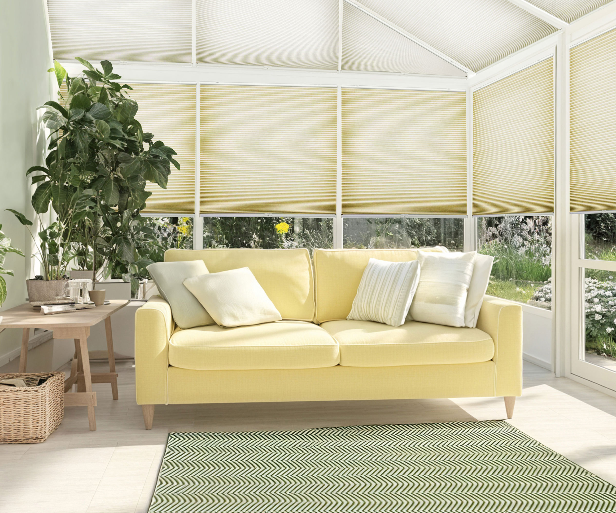 conservatory with yellow sofa and blinds