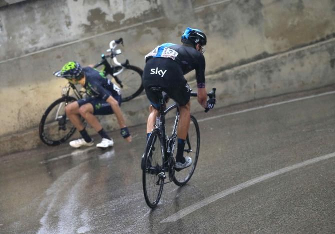 Bradley Wiggins (Sky) escapes a fallen Movistar rider during the heavy rain