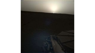NASA's InSight lander used the Instrument Deployment Camera (IDC) on the end of its robotic arm to image this sunset on Mars on April 25, 2019, the 145th Martian day, or sol, of the mission. This was taken around 6:30 p.m. Mars local time.