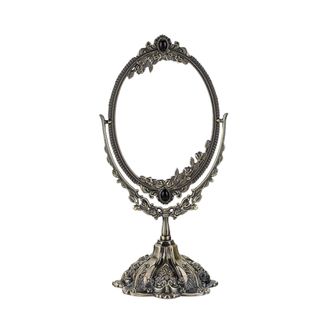 An intricate silver desk mirror