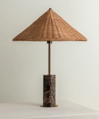 Ardini - 1 light rattan and brown marble table lamp on a white table cloth and cream background