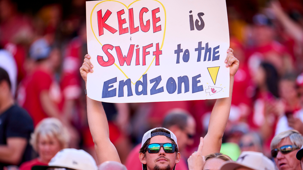 A fan holds a sign supporting Taylor Swift and Travis Kelce as the Kansas City Chiefs play the Chicago Bears during the first half at GEHA Field at Arrowhead Stadium on September 24, 2023 in Kansas City, Missouri.