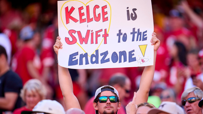 A fan holds a sign supporting Taylor Swift and Travis Kelce as the Kansas City Chiefs play the Chicago Bears during the first half at GEHA Field at Arrowhead Stadium on September 24, 2023