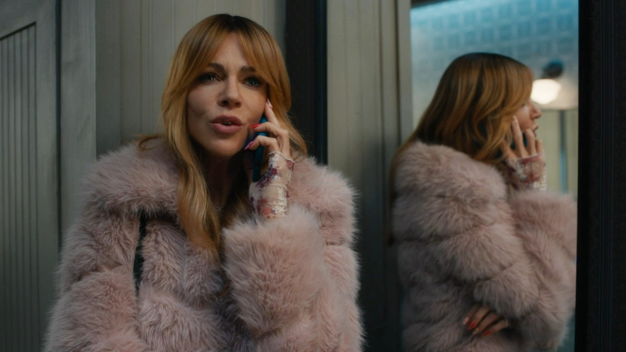 Kaitlin Olson on the phone in High Potential.