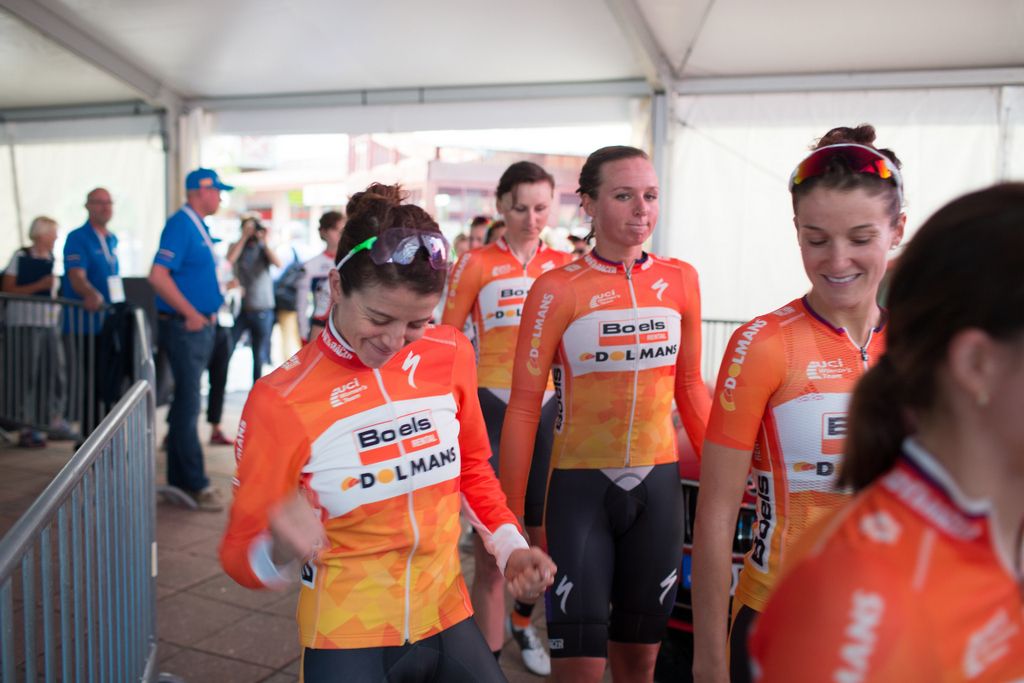 Evie Stevens punches the air on the way to the podium