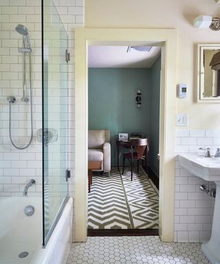 white hexagon tiles, shower, cream door frame
