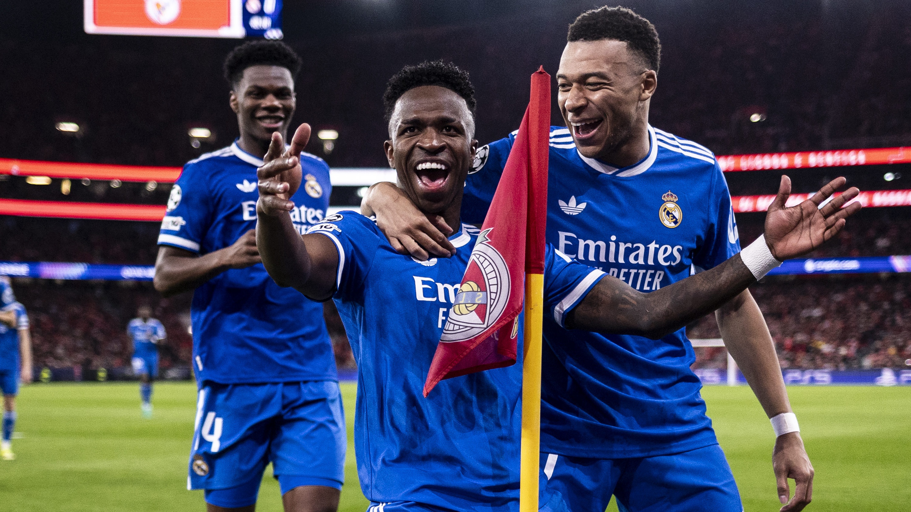 Vin&iacute;cius J&uacute;nior of Real Madrid (L) celebrates with Kylian Mbapp&eacute; of Real Madrid (R) after scoring the team's first goal during the UEFA Champions League 2025/26 League Knockout Play-off First Leg match between SL Benfica and Real Madrid C.F. at Estadio do SL Benfica on February 17, 2026 in Lisbon, Portugal. 