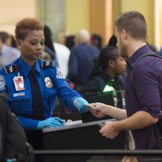 Female TSA agent at desk