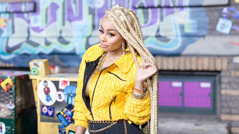 Blac Chyna pictured with braids and a yellow jacket is one of the highest paid celebrities on onlyfans