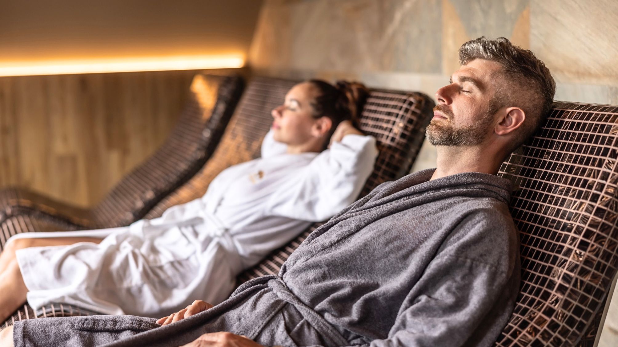 A couple resting at a luxury spa.