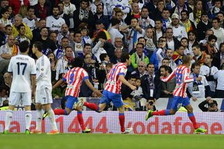 Joao Miranda celebrates with his Atletico Madrid team-mates after scoring the winner against Real Madrid in the 2013 Copa del Rey final at the Santiago Bernabeu.