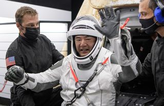 Japan Aerospace Exploration Agency astronaut Soichi Noguchi celebrates after returning to Earth on SpaceX's Crew-1 Crew Dragon capsule Resilience with a splashdown in the Gulf of Mexico near Panama City, Florida on May 2, 2021.
