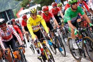 Team UAE Emirates Tadej Pogacar of Slovenia C wearing the leader yellow jersey Team Bahrains Wout Poels of Netherlands L wearing best climbers polka dot jersey and Team Deceuninck Quicksteps Mark Cavendish of Great Britain wearing green jersey of best sprinter rides prior the official start of the 9th stage of the 108th edition of the Tour de France cycling race 144 km between Cluses and Tignes on July 04 2021 Photo by Thomas SAMSON AFP Photo by THOMAS SAMSONAFP via Getty Images