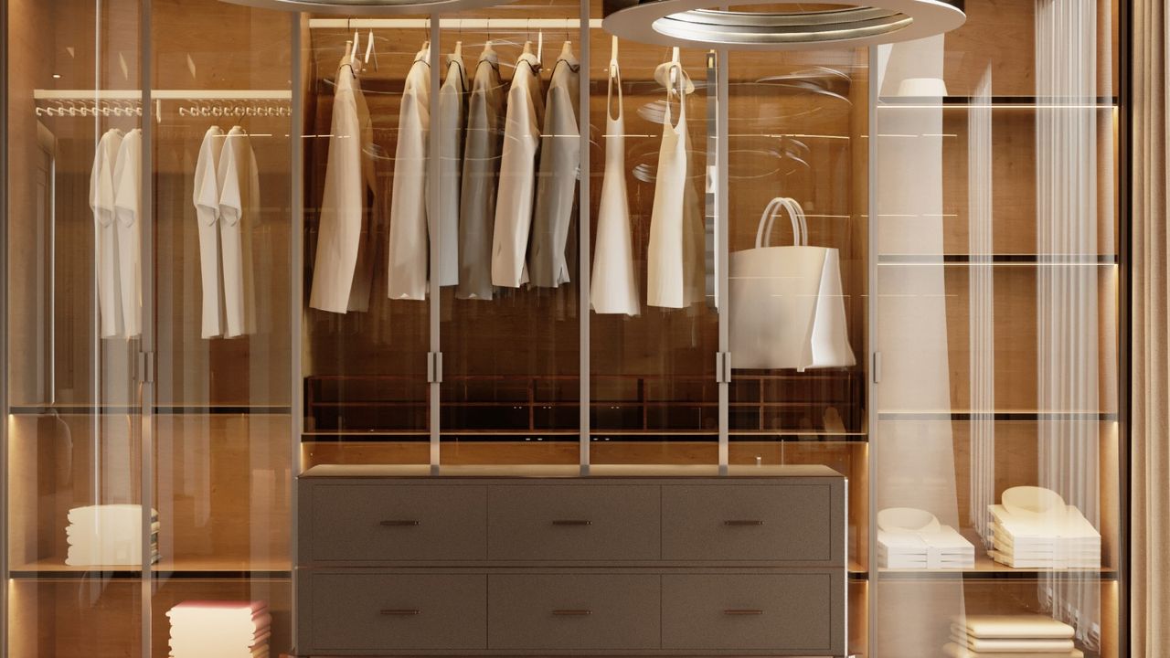 A walk-in closet designed in neutral colors