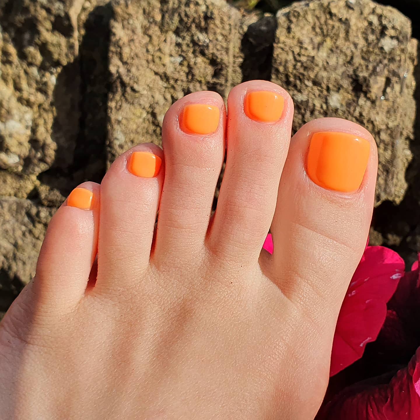 Photo of a jelly orange pedicure