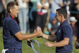 Poulter and McIlroy celebrate at the 2018 Ryder Cup