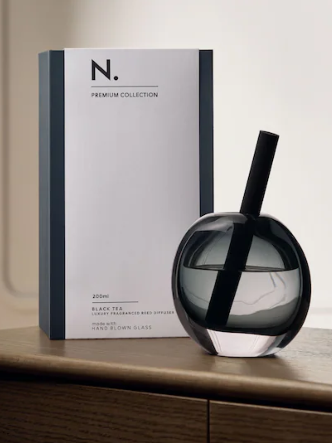 A black glass reed diffuser from Next